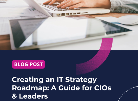 Business woman working on a laptop computer at an office, with a tablet computer in the foreground.